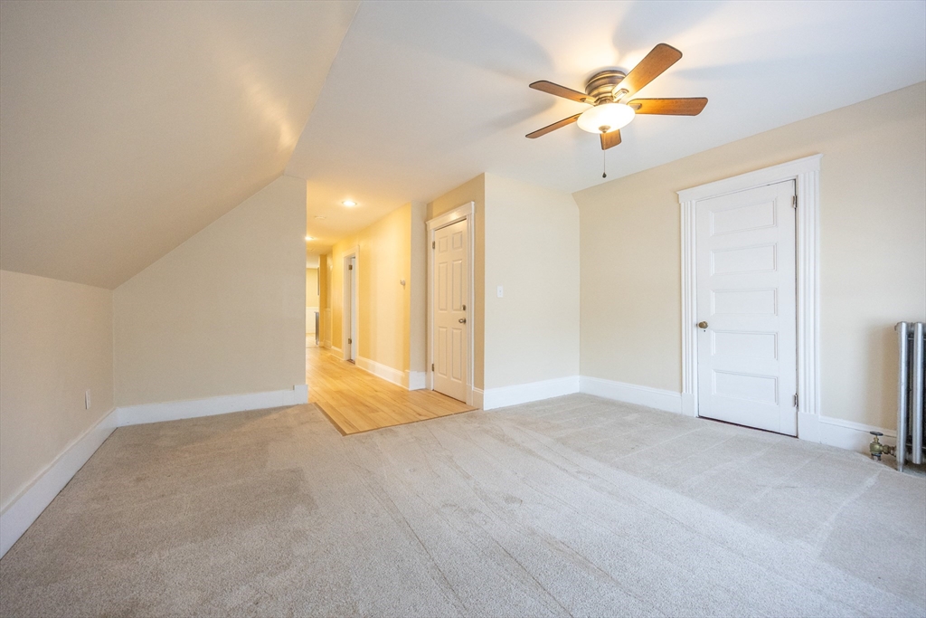 529 Adams Street, Unit 3 Boston, MA 02122 - Photo 9 of 11 a view of an empty room with a ceiling fan
