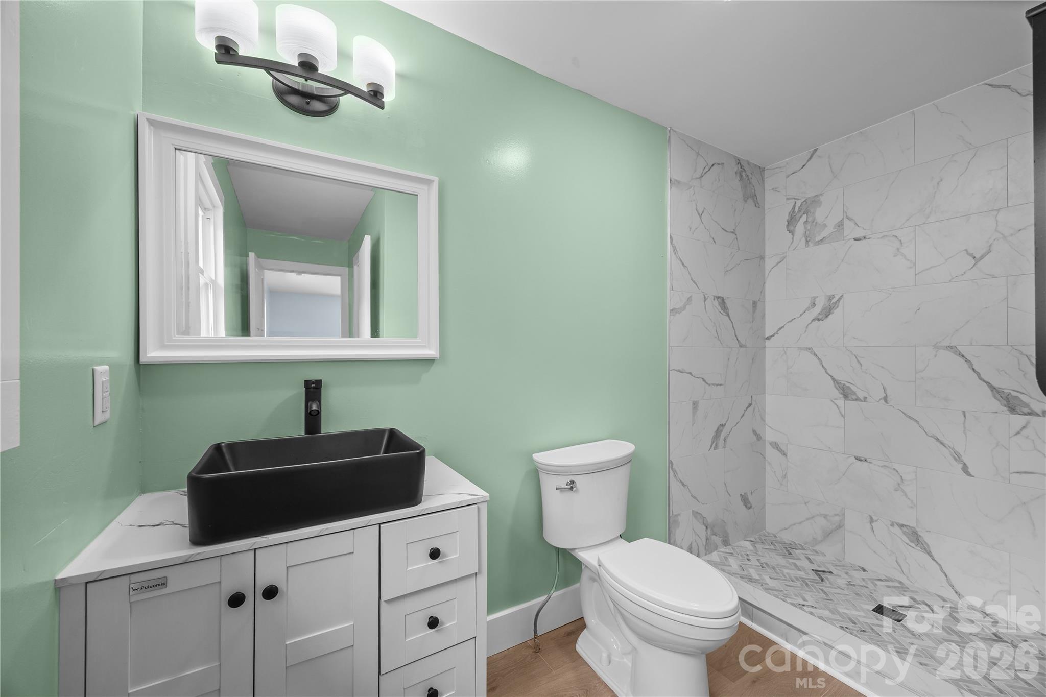 221 John C Logan Road Rutherfordton, NC 28139 - Photo 9 of 20 a bathroom with a toilet sink and mirror