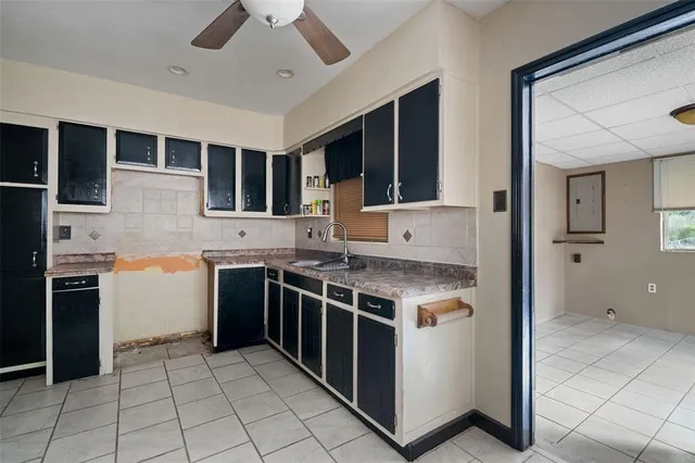 a kitchen with stainless steel appliances granite countertop a stove and a refrigerator