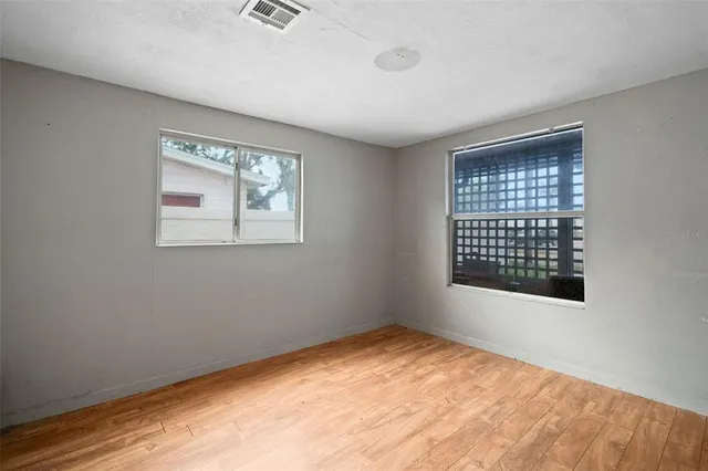 a view of an empty room with a window