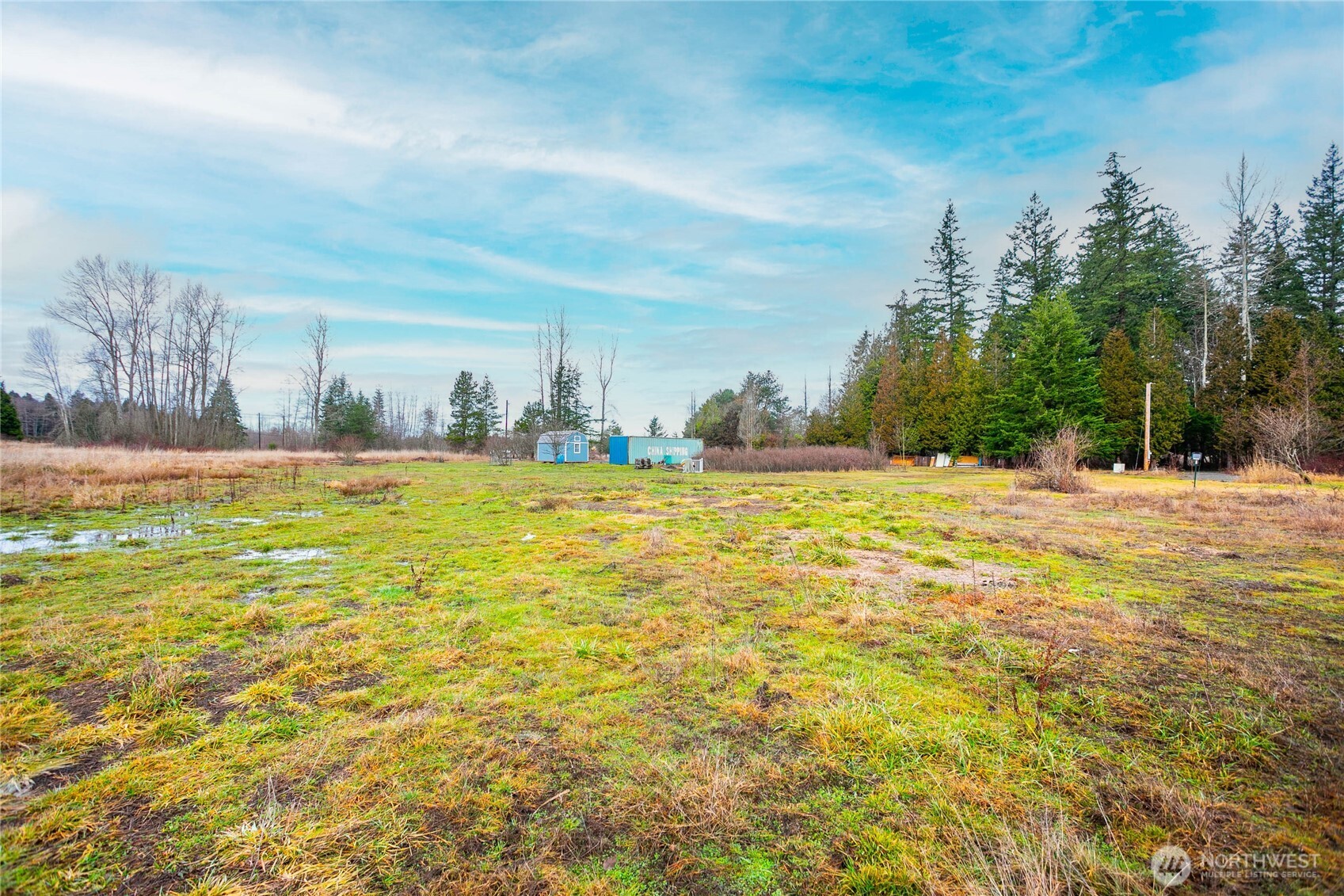 8358 Blaine Road Blaine, WA 98230 - Photo 8 of 17 a view of an ocean with a building in the background