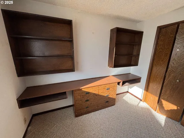 a bathroom with a sink and mirror with bathtub