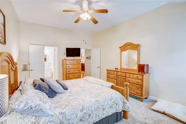 a bedroom with a bed and a dresser