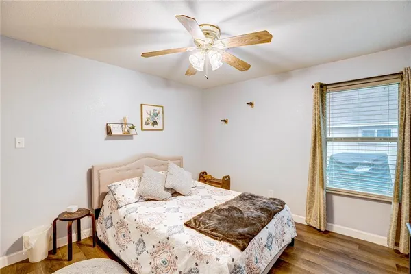 a bed room with a bed and a window