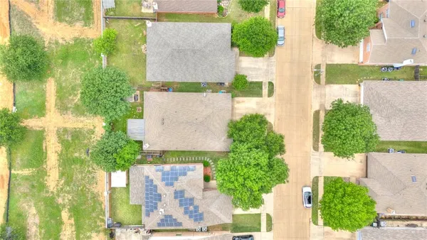 an aerial view of a house with yard swimming pool and outdoor seating