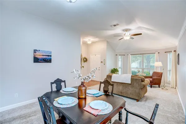 a living room with furniture and a table