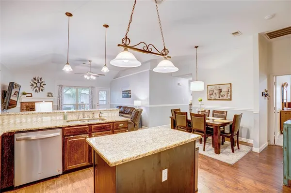 a open kitchen with a table and chairs in it