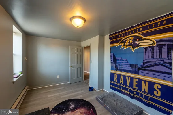 a bathroom with a sink toilet and window