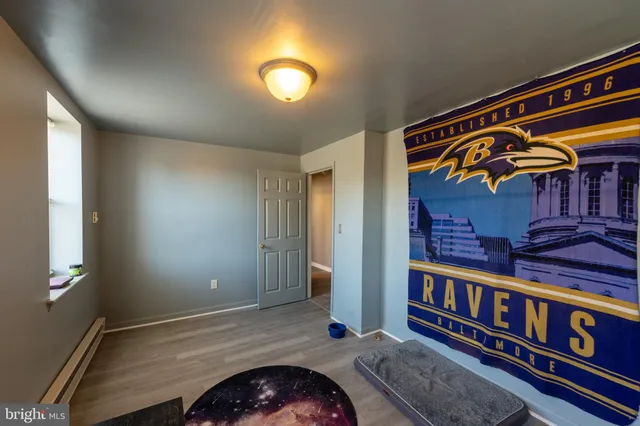 a bathroom with a sink toilet and window