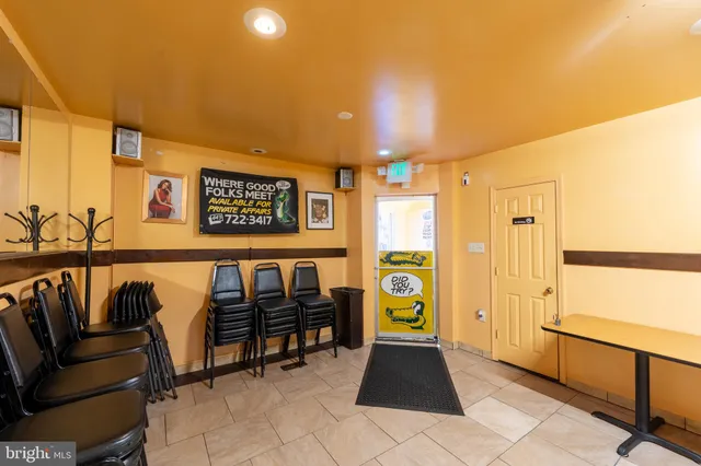 a living room with a couch and a stove top oven