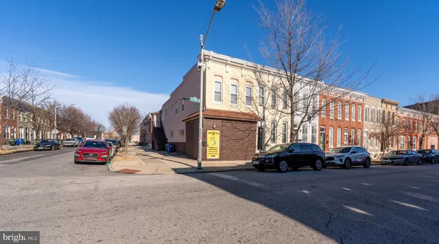 a view of street with parked cars