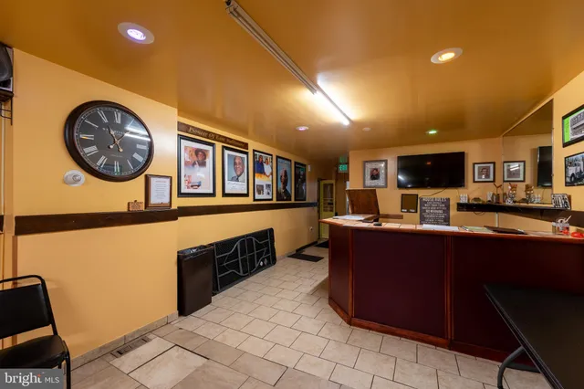 a lobby with furniture and a rug