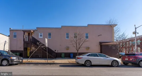 a view of a cars park in front of a house