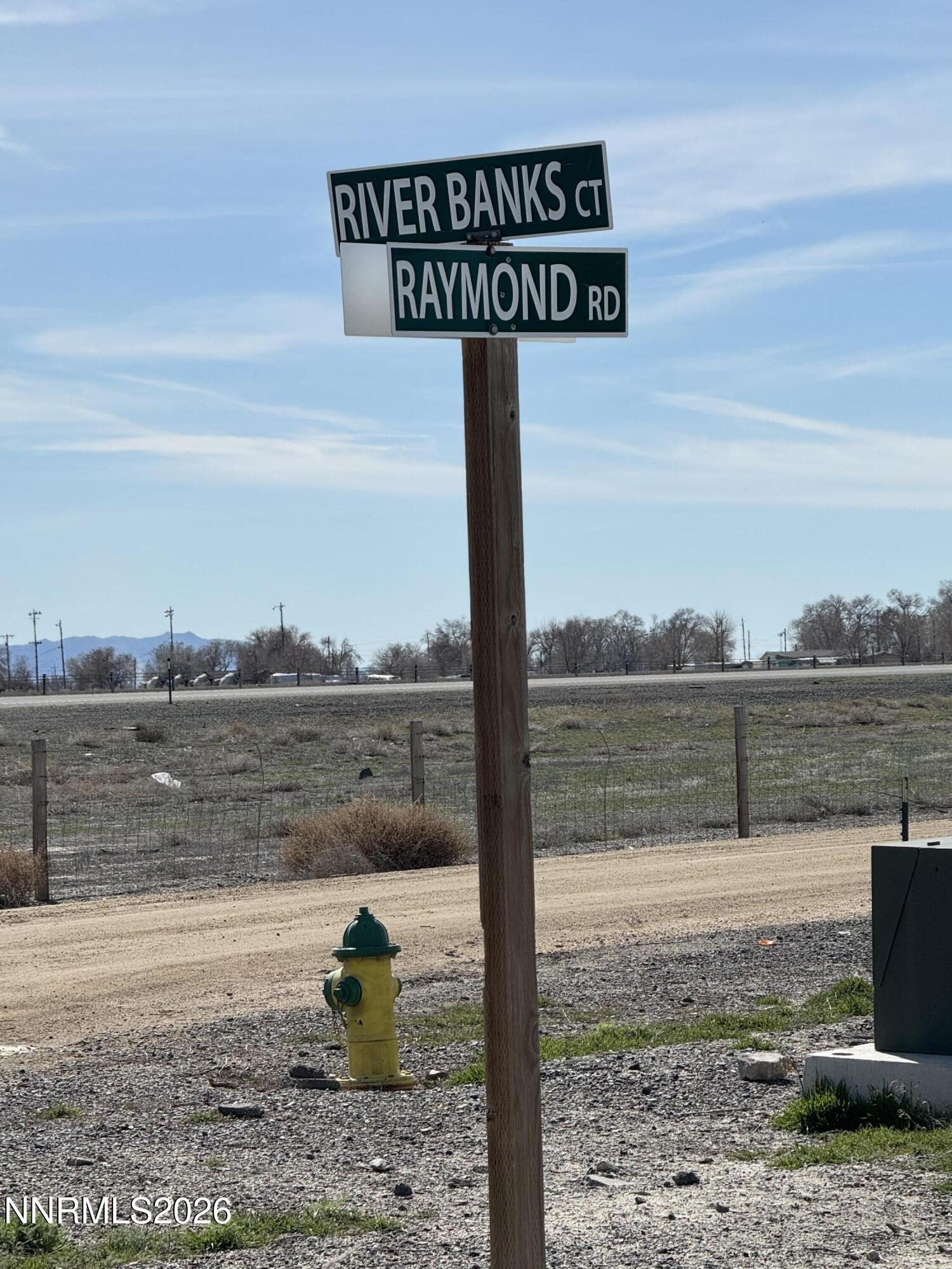88 River Banks Court Lovelock, NV 89419 - Photo 2 of 8 a street sign on a pier next to a lake