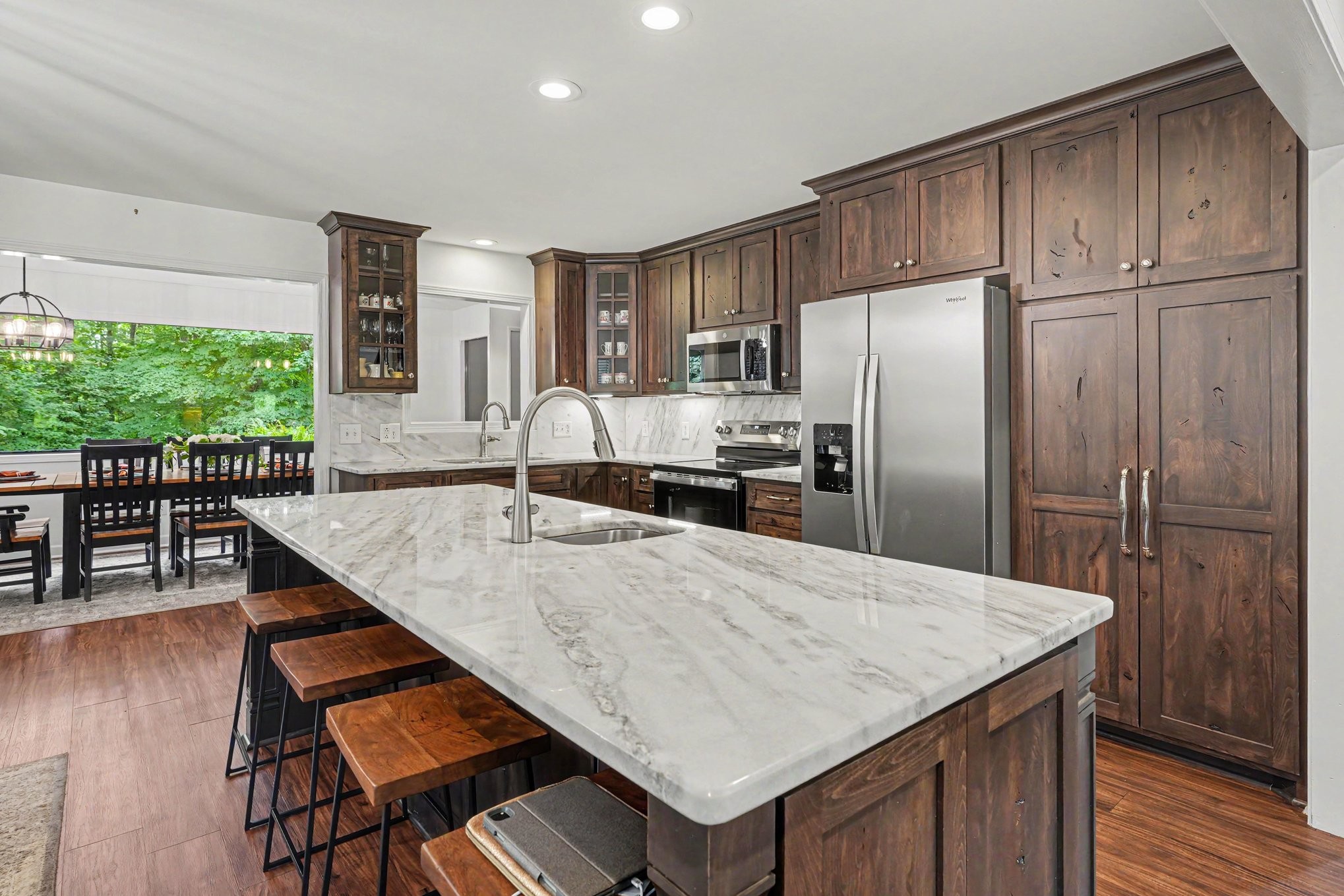 5833 Highway 76 East Springfield, TN 37172 - Photo 4 of 66 a kitchen with stainless steel appliances granite countertop a refrigerator a stove and a wooden floors