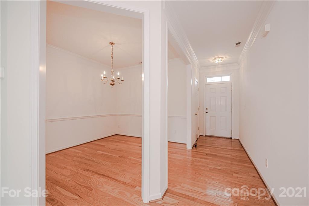 4928 Missi Lane, Unit 471 Fort Mill, SC 29708 - Photo 4 of 32 a view of a hallway with wooden floor