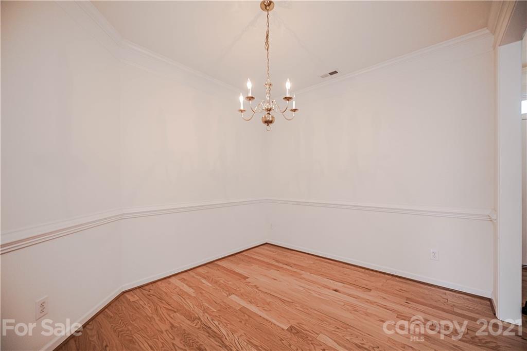 4928 Missi Lane, Unit 471 Fort Mill, SC 29708 - Photo 5 of 32 a view of a room with wooden floor and fan
