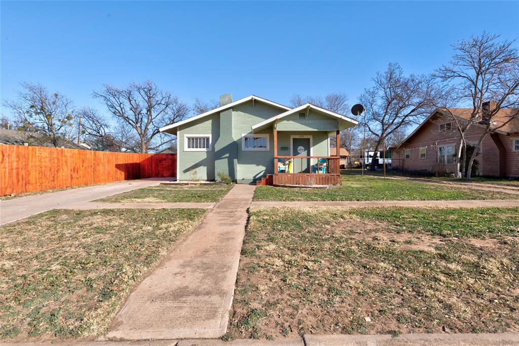 449 Clinton Street Abilene, TX 79603 - Photo 1 of 34 a front view of a house with a yard and garage