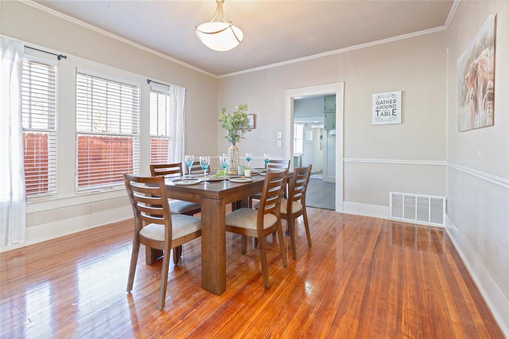 449 Clinton Street Abilene, TX 79603 - Photo 11 of 34 a view of a dining room with furniture and wooden floor