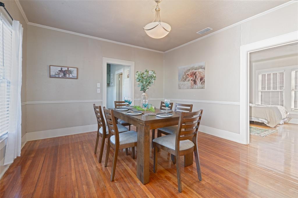 449 Clinton Street Abilene, TX 79603 - Photo 12 of 34 a view of a dining room with furniture and wooden floor