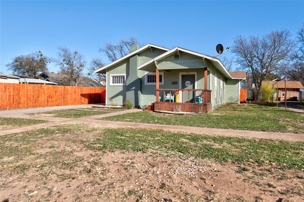 449 Clinton Street Abilene, TX 79603 - Photo 2 of 34 a front view of a house with garden