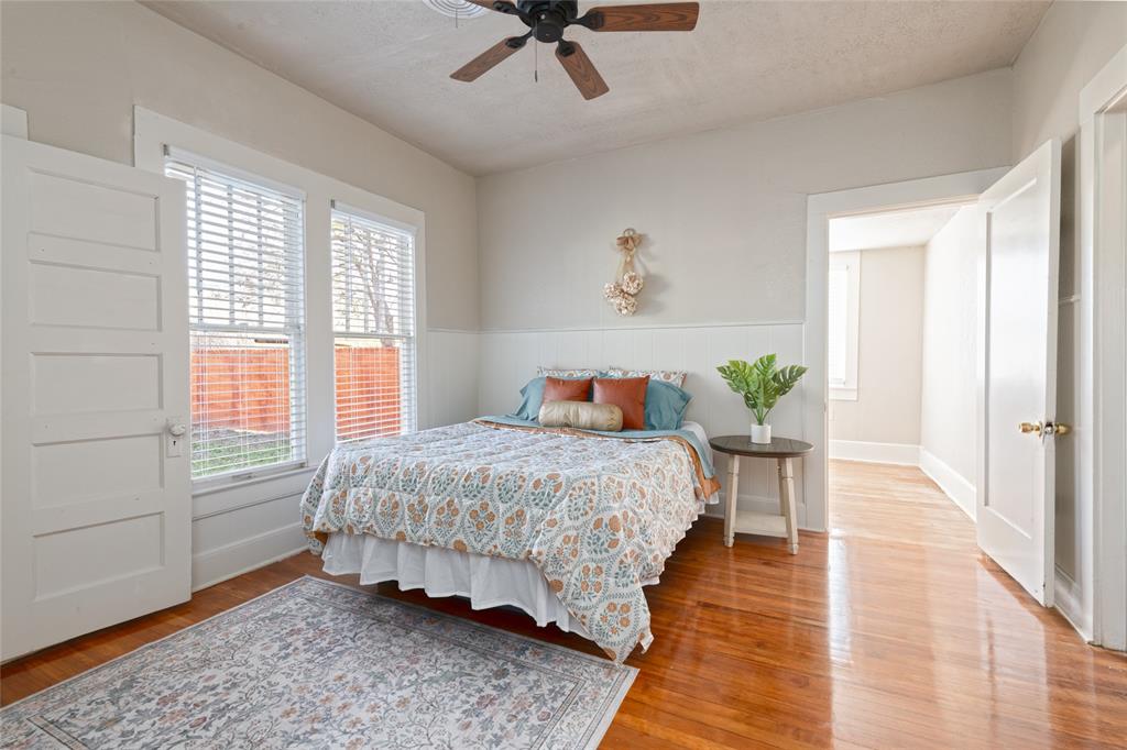 449 Clinton Street Abilene, TX 79603 - Photo 22 of 34 a bedroom with a bed and wooden floor