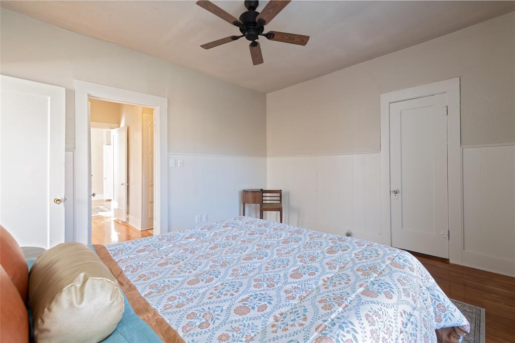 449 Clinton Street Abilene, TX 79603 - Photo 25 of 34 a bedroom with a bed and a chandelier