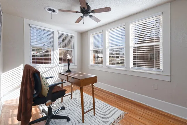 a bedroom with furniture and a window