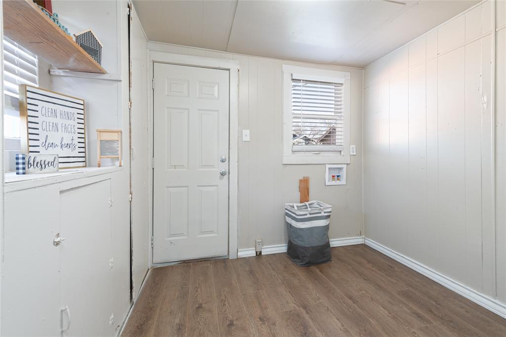 449 Clinton Street Abilene, TX 79603 - Photo 30 of 34 a room that has a chair and wooden floor