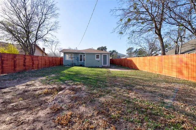 a view of backyard with tree