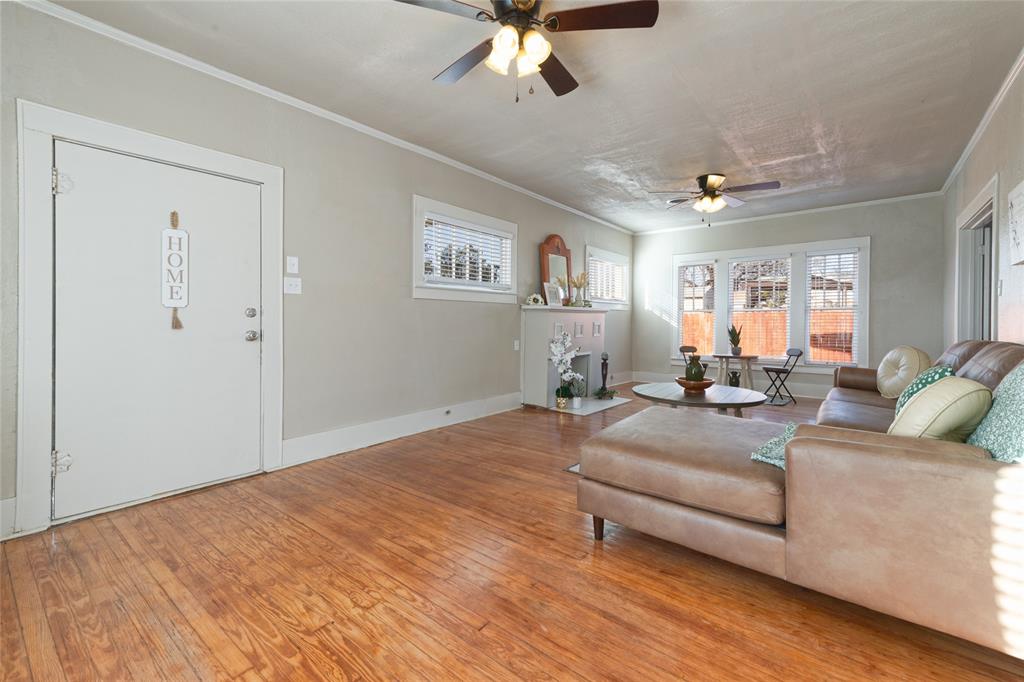 449 Clinton Street Abilene, TX 79603 - Photo 8 of 34 a living room with furniture and a chandelier