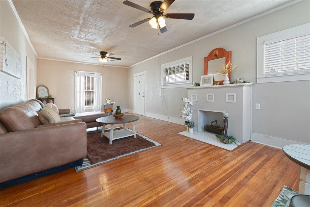 449 Clinton Street Abilene, TX 79603 - Photo 9 of 34 a living room with furniture and a fireplace