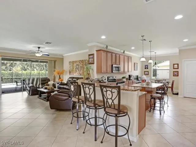 a large kitchen with a table and chairs