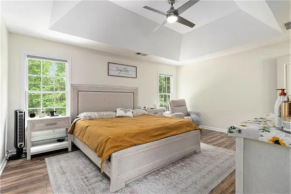 a bedroom with a bed and window