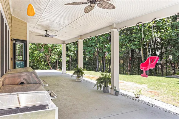 a view of swimming pool with a patio