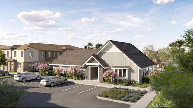 a front view of multiple houses with small garden