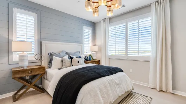 a bedroom with bed and a window