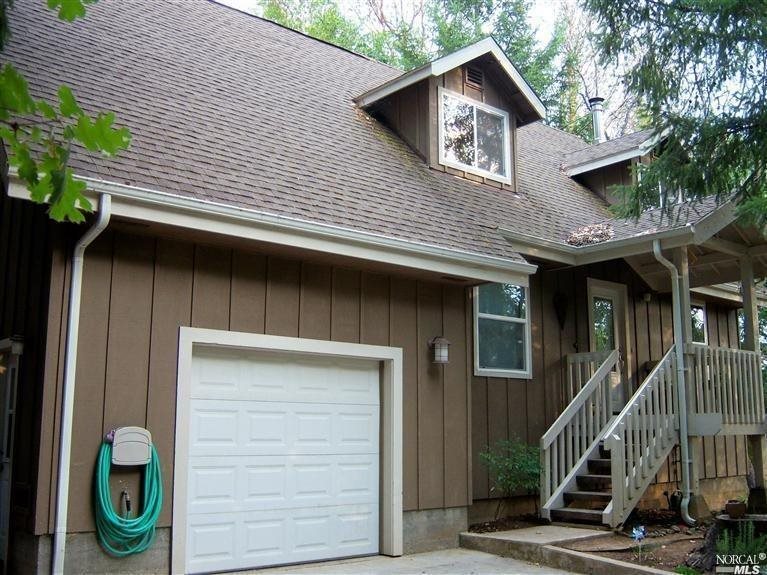 a front view of a house with garage