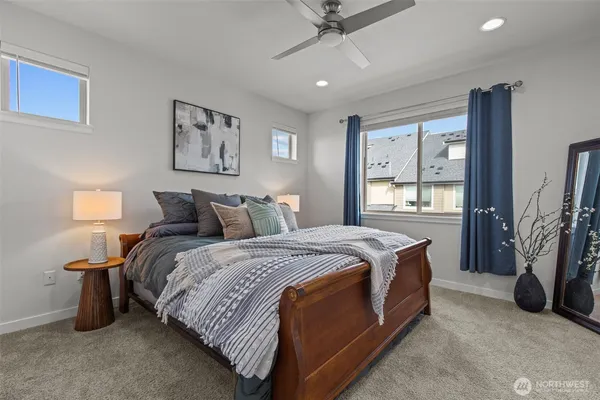 a bed room with a bed and a flat tv screen