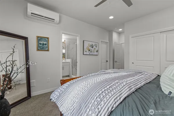 a bedroom with a bed and a couch