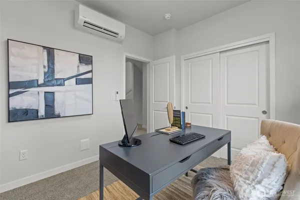 a view of a workspace with furniture