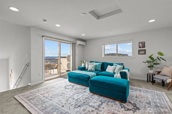 a living room with furniture and a rug
