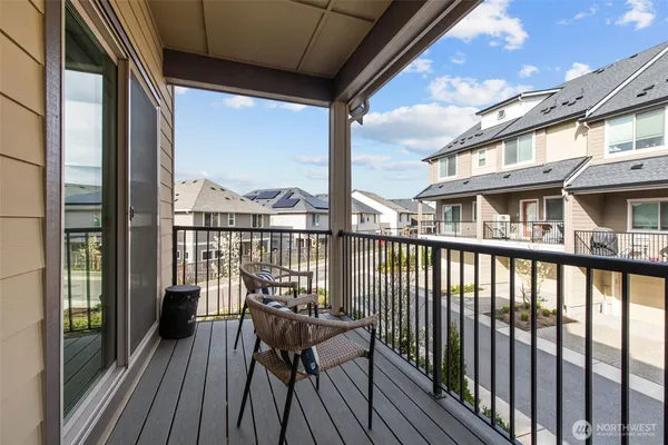 a view of a balcony with chairs