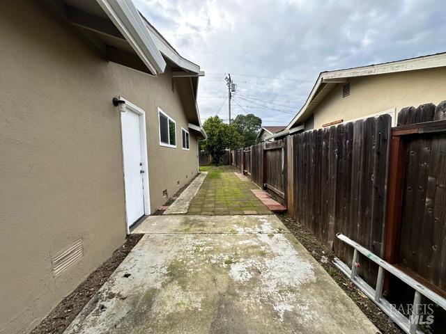 2119 Tipton Way Fairfield, CA 94533 - Photo 3 of 11 a view of a house with wooden floor and a wooden fence