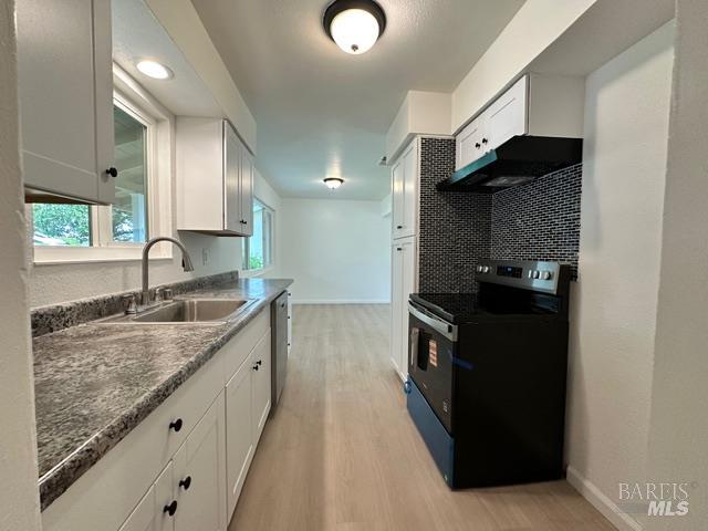 2119 Tipton Way Fairfield, CA 94533 - Photo 4 of 11 a kitchen with granite countertop a sink and a stove top oven