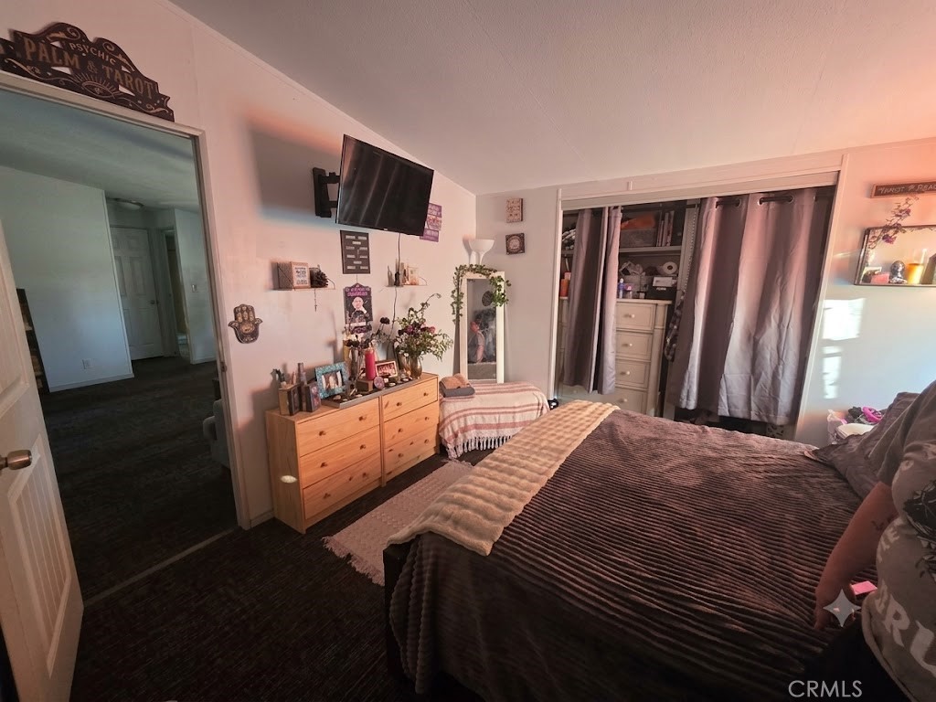 10623 Desert View Road Pinon Hills, CA 92372 - Photo 27 of 76 a bedroom with a bed and a television