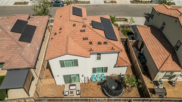 a view of a yard with an outdoor seating