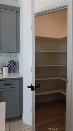 a close view of closet and wooden floor