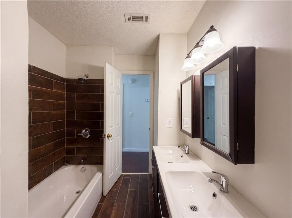 3753 Soapstone Road Decatur, GA 30034 - Photo 6 of 26 a bathroom with a bathtub and a sink