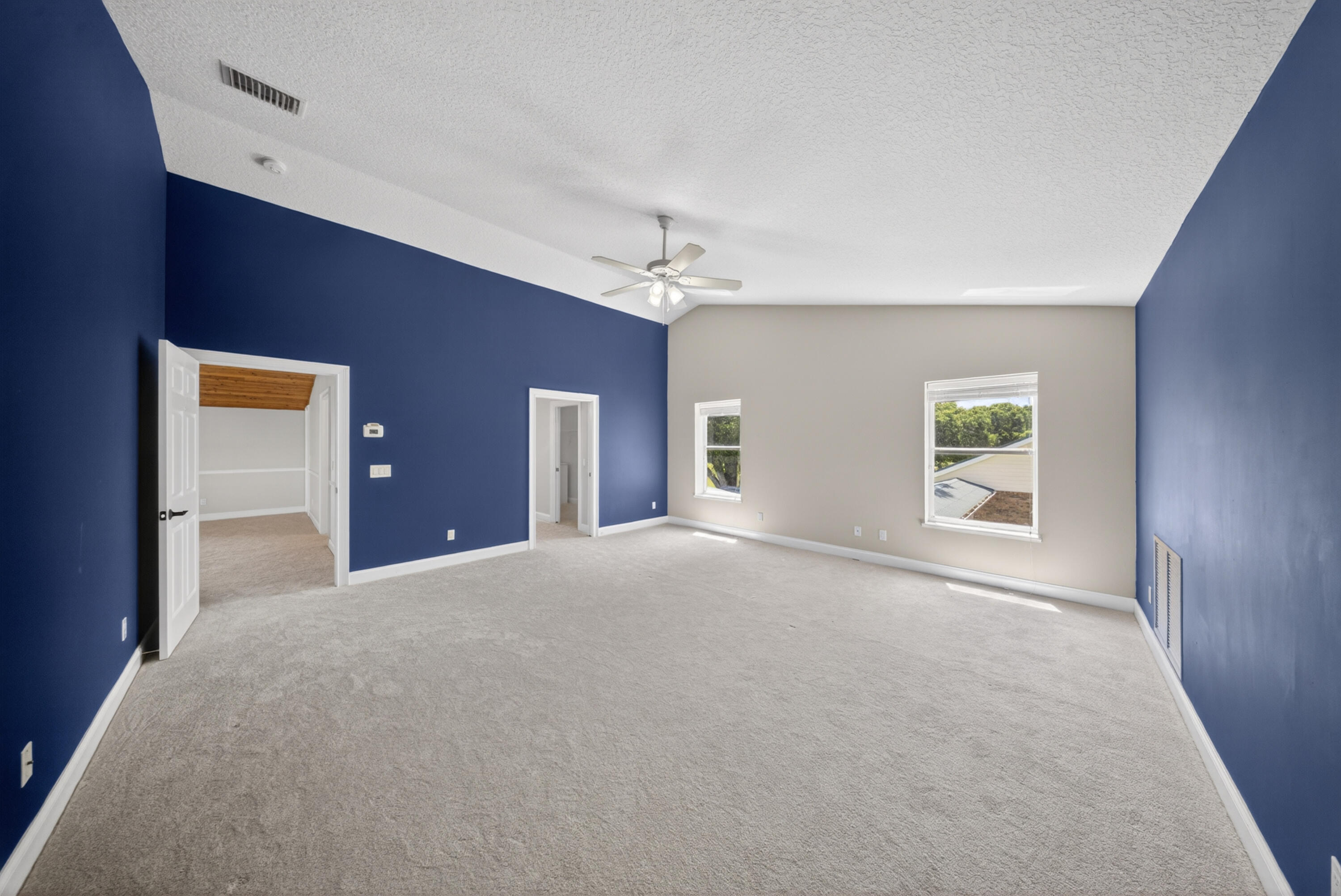 8686 Andrews Avenue Fort Pierce, FL 34945 - Photo 50 of 76 a view of a livingroom with a ceiling fan and window
